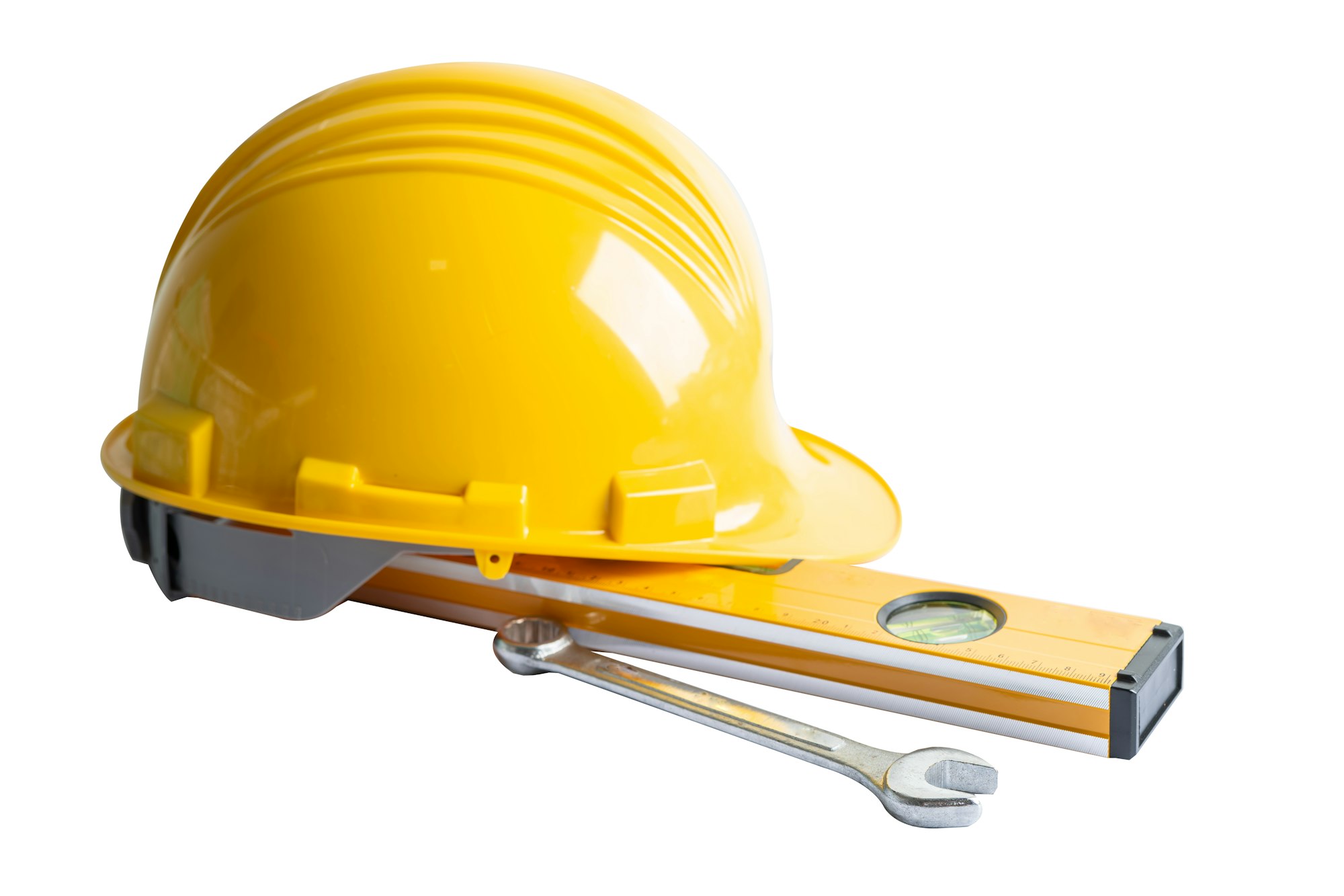 Construction helmet and tools for engineering work project on white background.